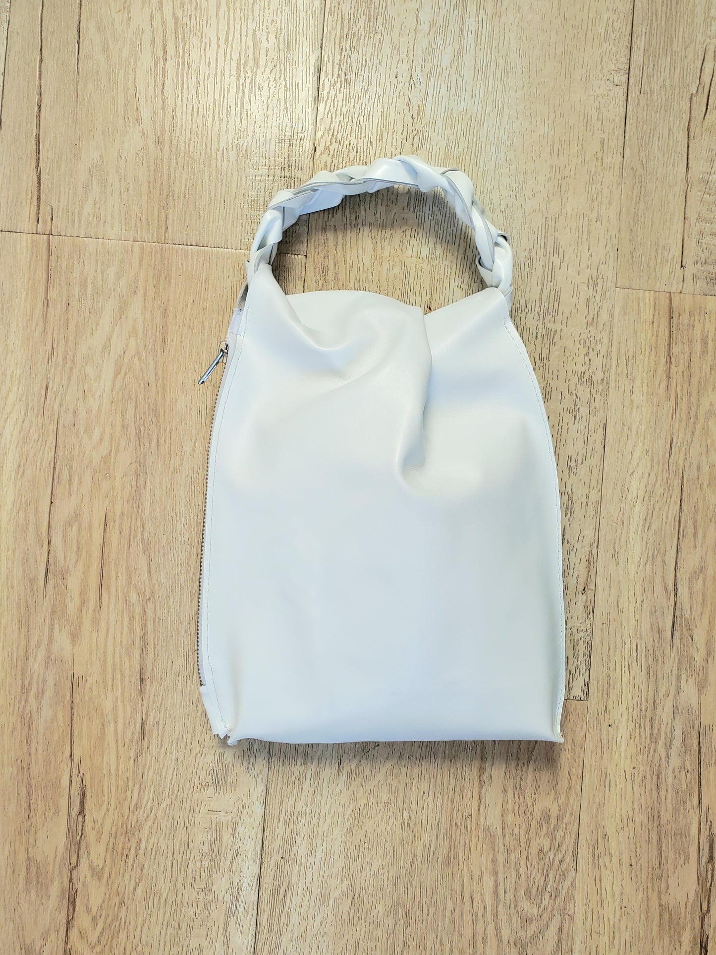 White leather bag with braided handle. Made in Los Angeles, California