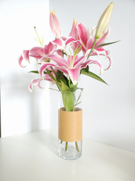 Leather wrapped around a glass vase made in Los Angeles California