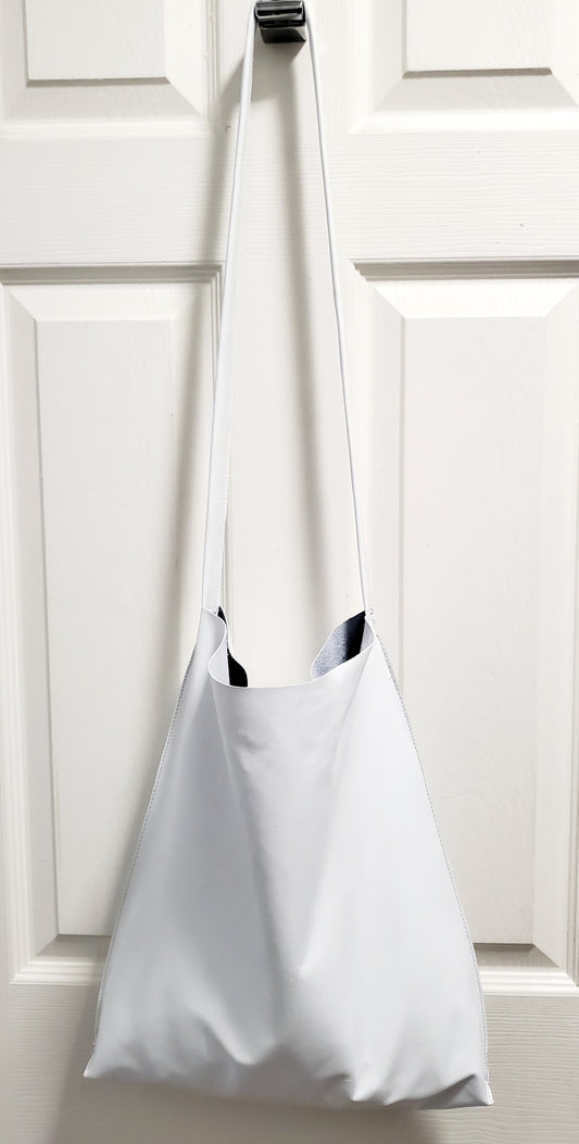 White leather crossbody bag with double inside pockets.  Handcrafted in Los Angeles California