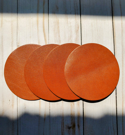 Tan leather round voaster set of 4 made in Los Angeles California