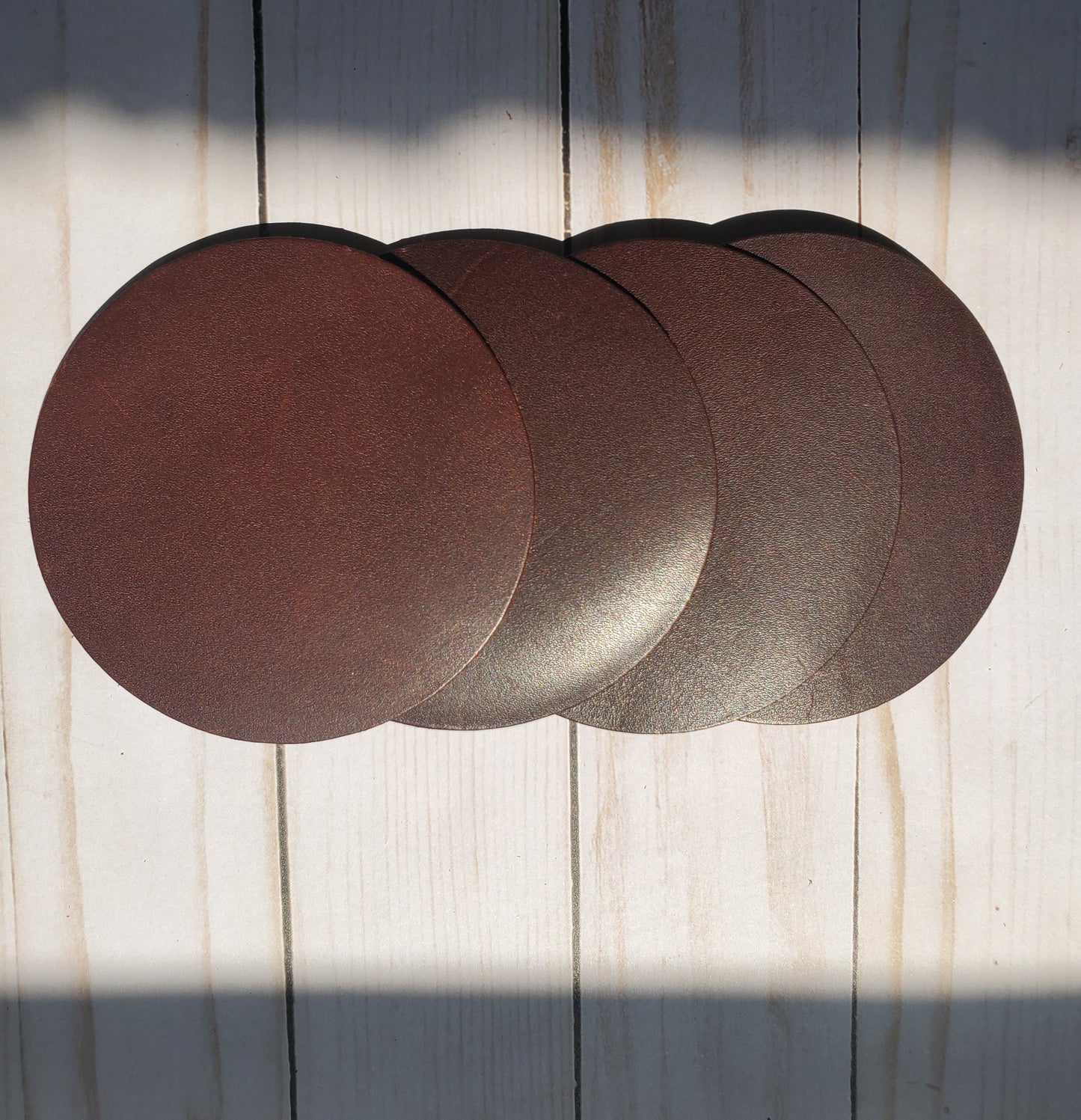Brown round leather coaster set of 4. Made in Los Angeles,California
