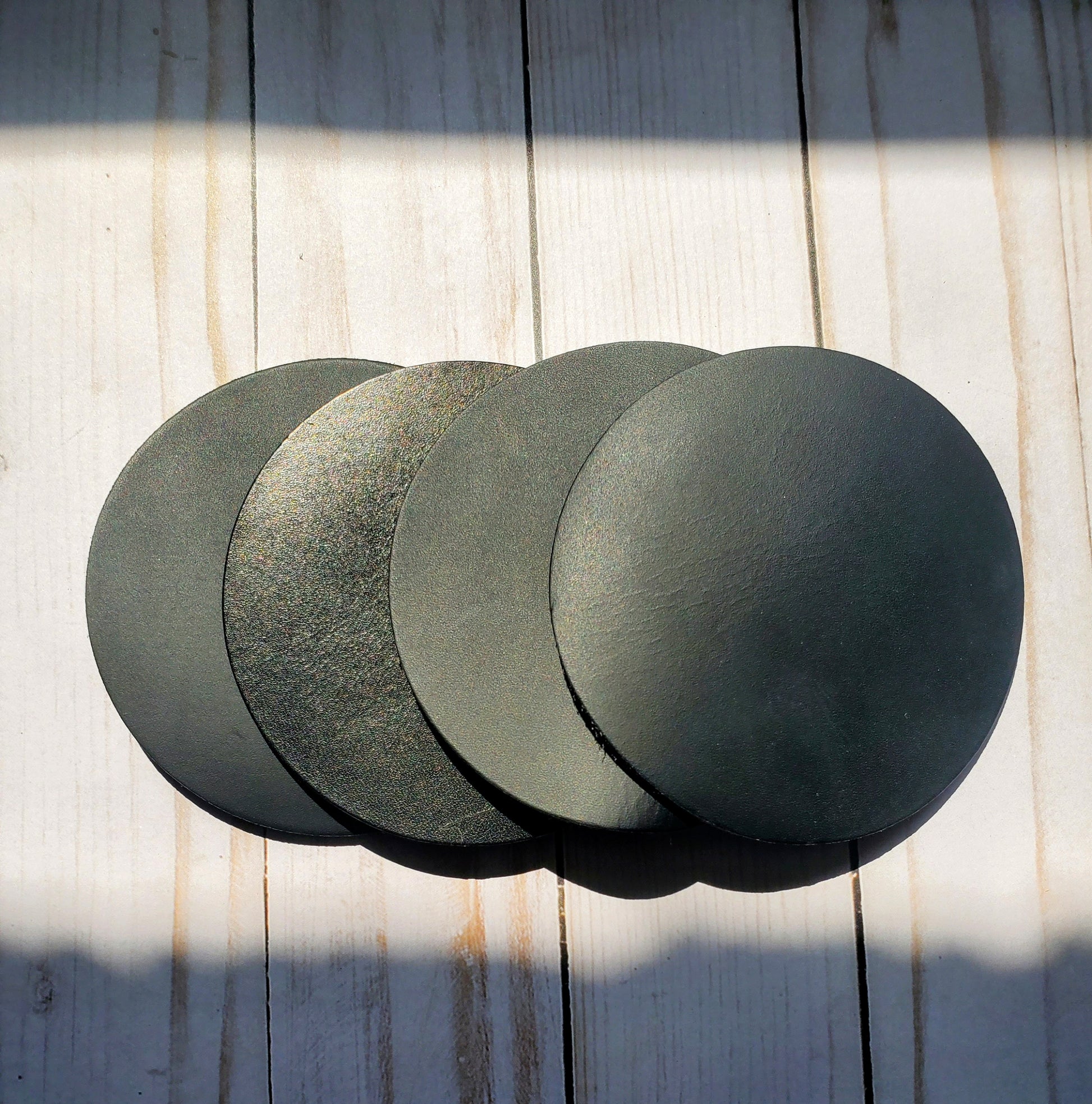 Handmade 4 inch black set of 4 round leather coasters made in Los Angeles,California