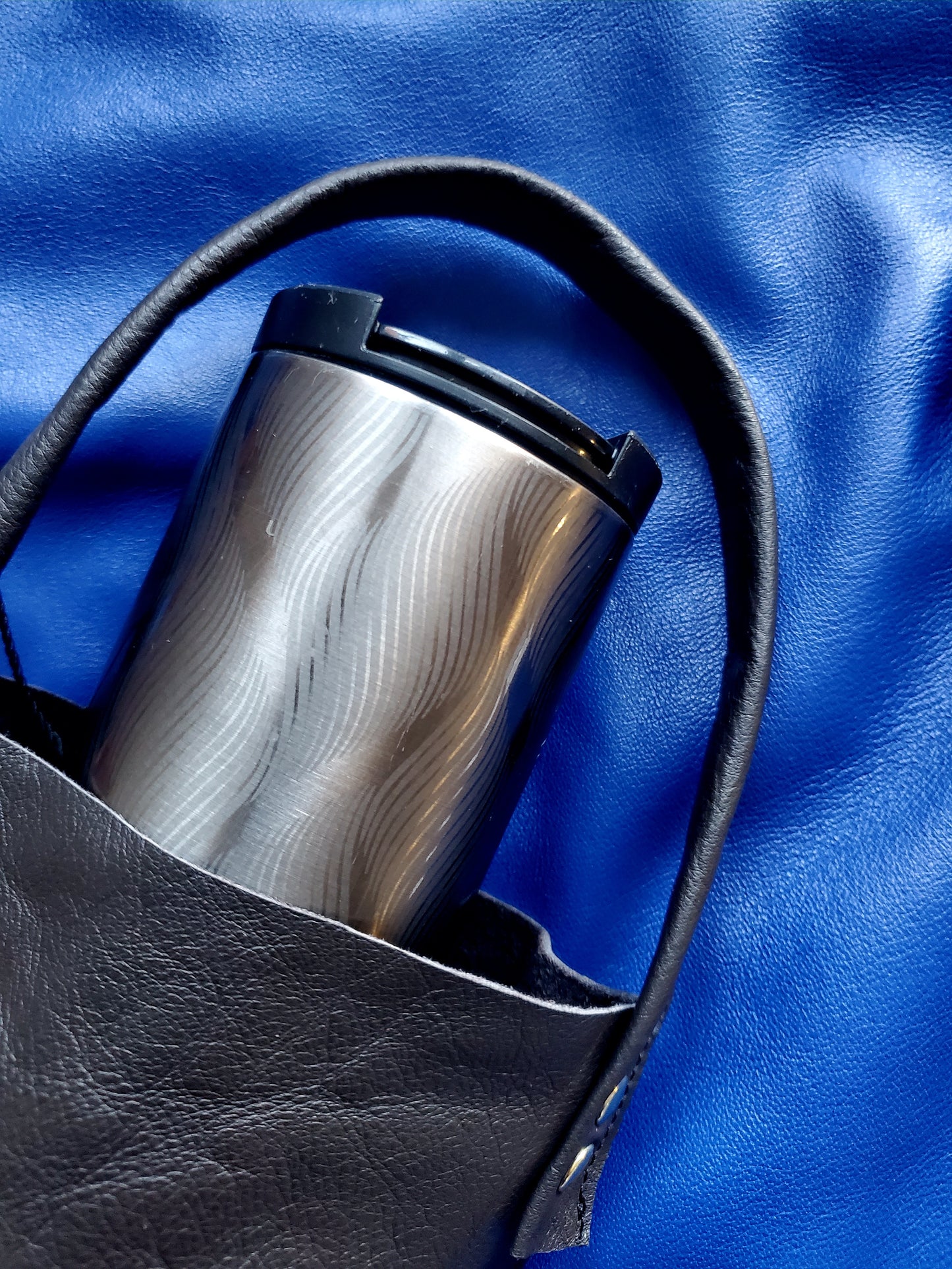 Smooth black leather bottle bag. Made in Los Angeles,California