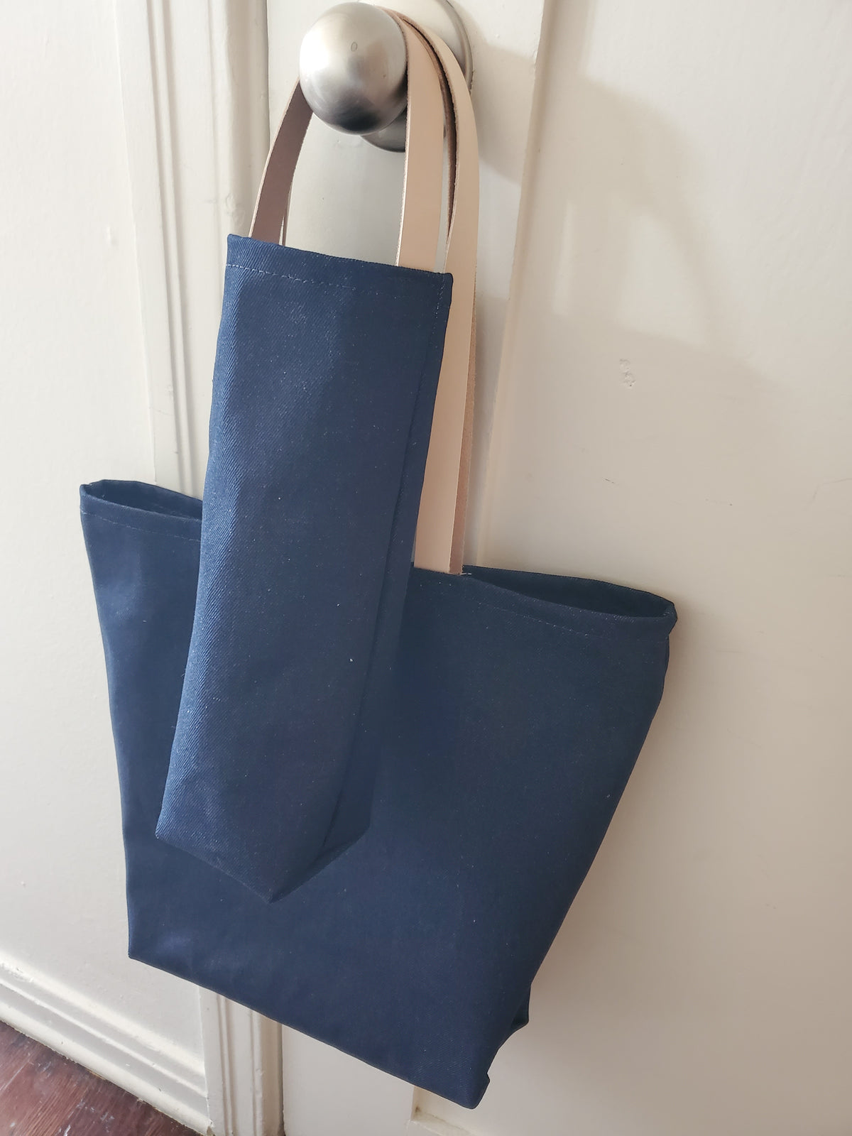 Denim tote bag with denim wine bag with leather handles.  Mae in Los Angeles California 