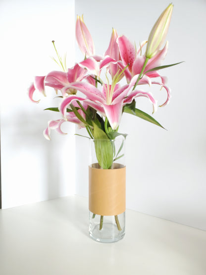 Leather wrapped around a glass vase made in Los Angeles California 
