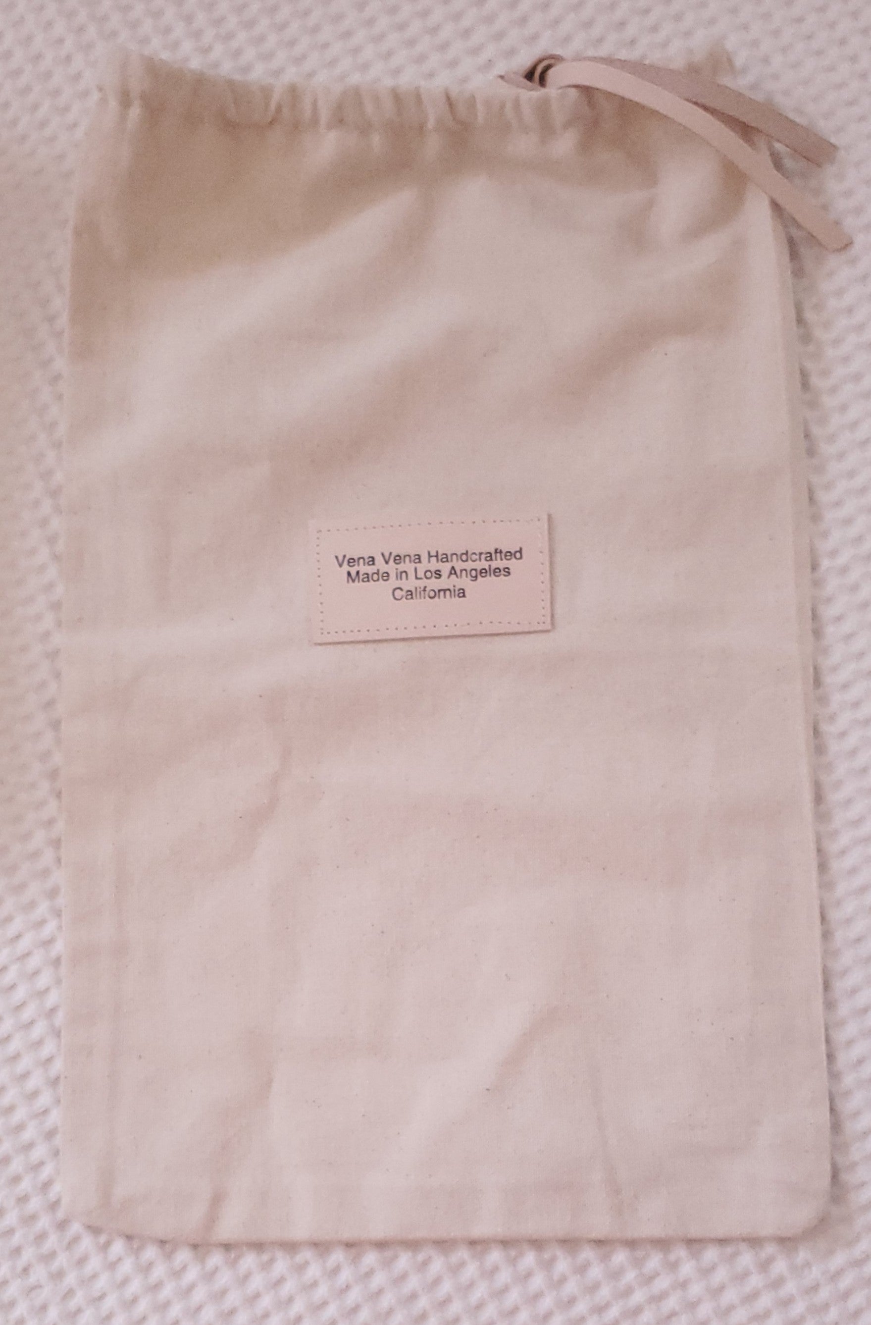 Canvas shoe bag with leather closure. Made in Los Angeles California 